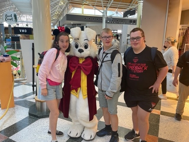 Young people pictured with rabbit character