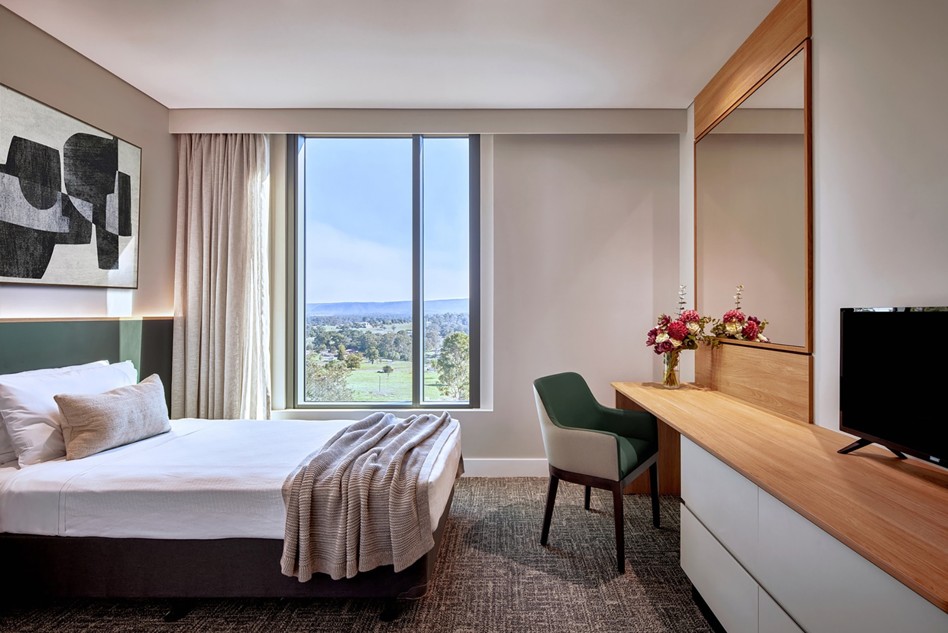 St John of God Richmond Hospital redevelopment accommodation room with bed, desk and window view