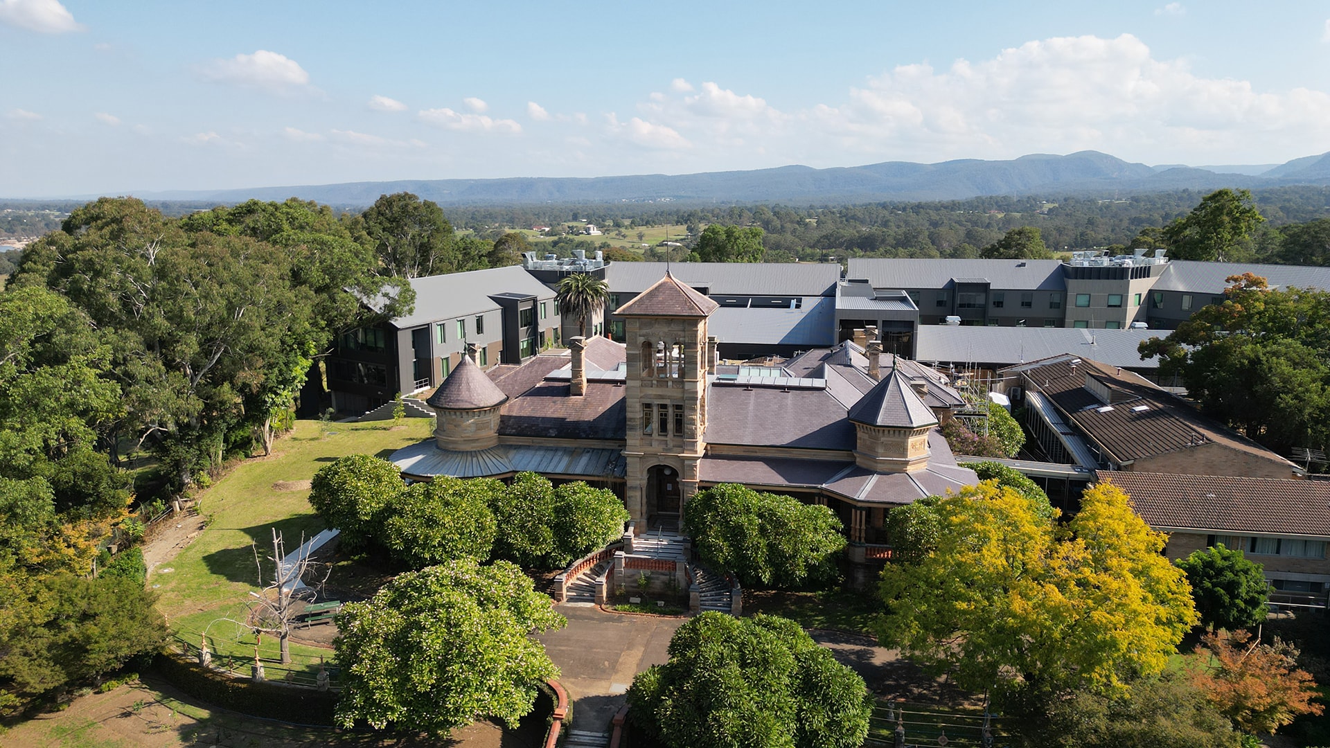 St John of God Richmond Hospital facade with historical entrance in foreground and new redevelopment behind